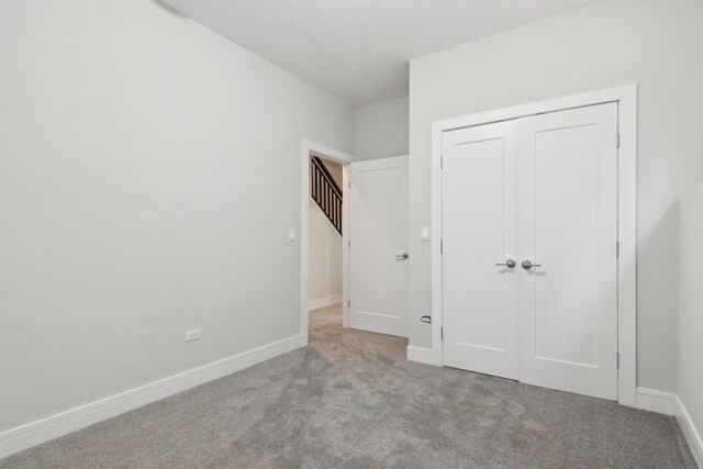 4637 S Michigan Ave, Chicago, IL 60653 - unfurnished bedroom with carpet floors, a closet, and baseboards