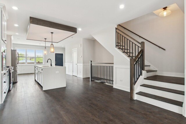 4637 S Michigan Ave, Chicago, IL 60653 - kitchen featuring a sink, dark wood-style flooring, light countertops, white cabinetry, and recessed lighting