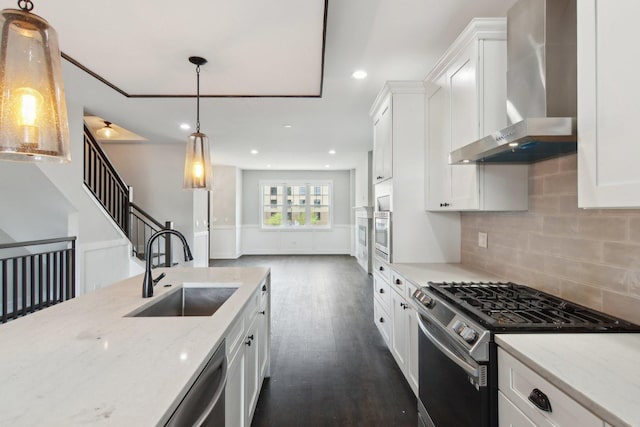 4637 S Michigan Ave, Chicago, IL 60653 - kitchen with appliances with stainless steel finishes, wall chimney range hood, a sink, white cabinets, and recessed lighting