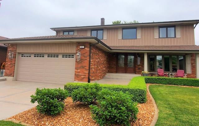 6421 157th St W, Oak Forest, IL 60452 - view of front facade featuring french doors, an attached garage, driveway, and brick siding