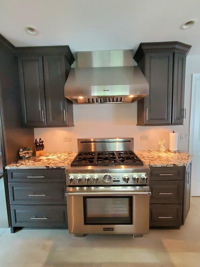 6421 157th St W, Oak Forest, IL 60452 - kitchen featuring gas range, wall chimney range hood, and light stone countertops