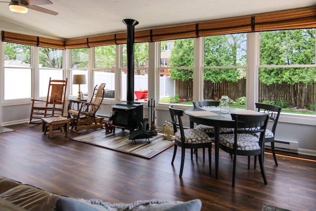 6421 157th St W, Oak Forest, IL 60452 - sunroom / solarium with a wood stove, baseboards, wood finished floors, a wooden deck, and vaulted ceiling