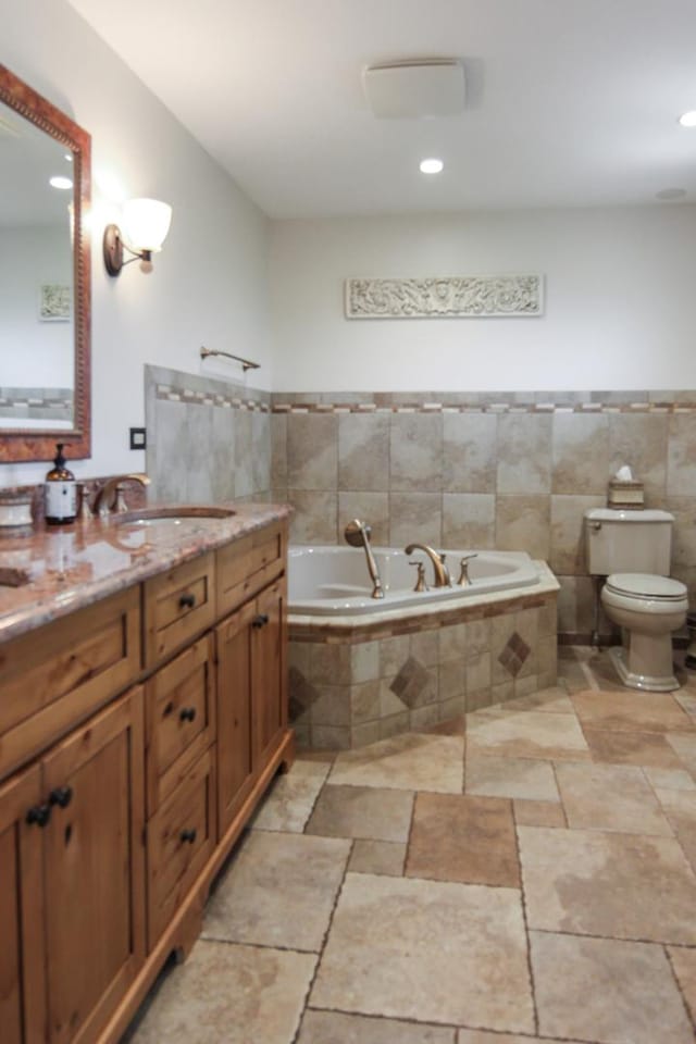 6421 157th St W, Oak Forest, IL 60452 - full bathroom featuring a bath, toilet, vanity, recessed lighting, and stone finish flooring