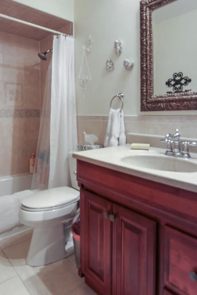 6421 157th St W, Oak Forest, IL 60452 - full bathroom with vanity, toilet, shower / tub combo, tile patterned flooring, and tile walls