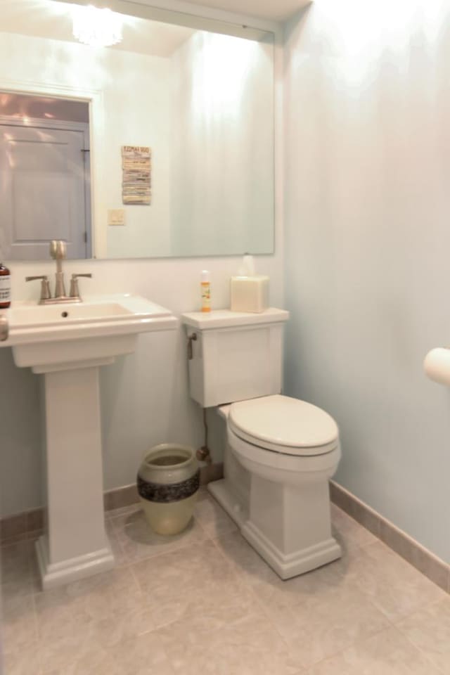 6421 157th St W, Oak Forest, IL 60452 - bathroom with toilet, baseboards, and tile patterned floors