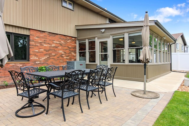 6421 157th St W, Oak Forest, IL 60452 - view of patio / terrace with a sunroom and outdoor dining space