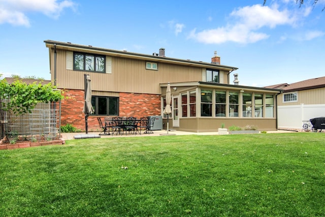 6421 157th St W, Oak Forest, IL 60452 - back of property featuring a chimney, brick siding, a patio area, and a sunroom