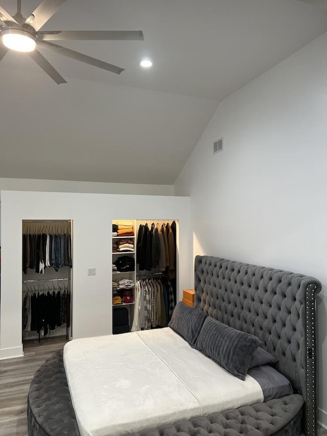 7801 S Seeley Ave, Chicago, IL 60620 - bedroom featuring wood finished floors, lofted ceiling, recessed lighting, and multiple closets