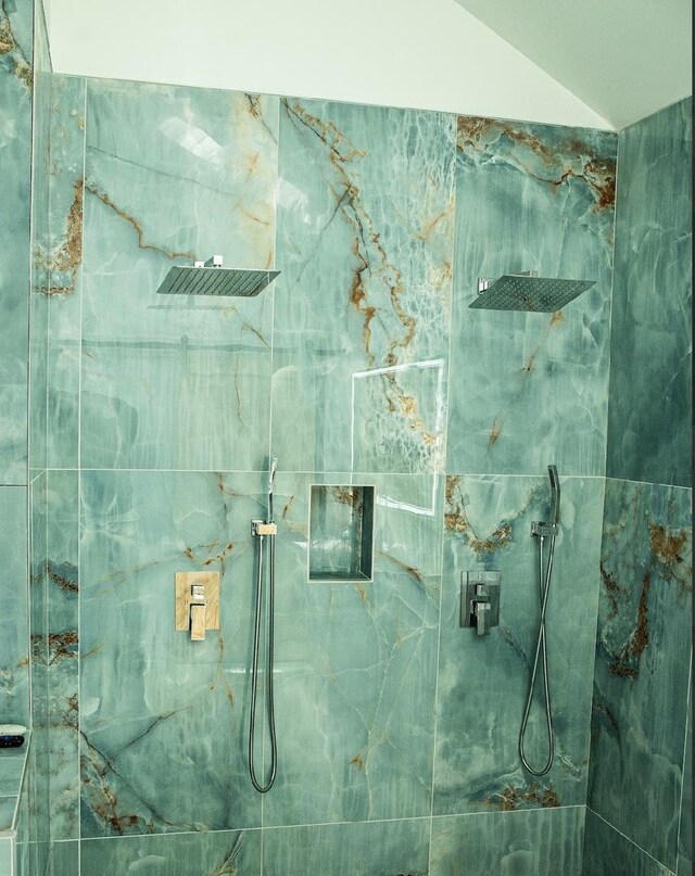 7801 S Seeley Ave, Chicago, IL 60620 - bathroom featuring a marble finish shower and lofted ceiling