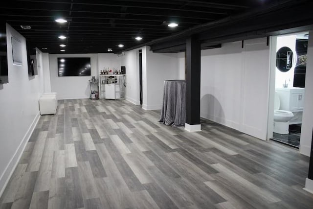7801 S Seeley Ave, Chicago, IL 60620 - finished below grade area featuring wood finished floors, bar, and baseboards