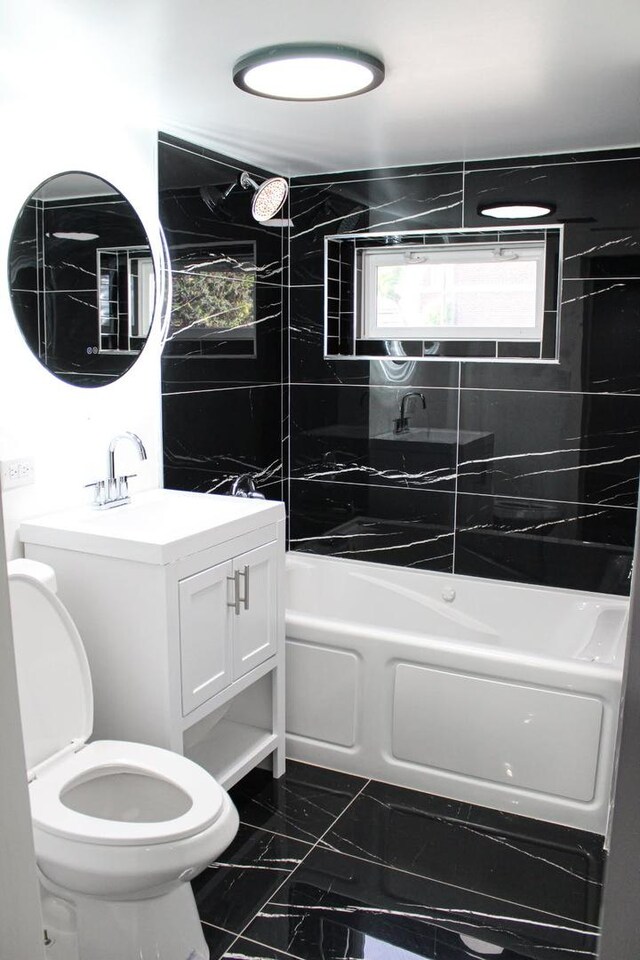 7801 S Seeley Ave, Chicago, IL 60620 - full bathroom featuring toilet,  shower combination, marble finish flooring, and vanity