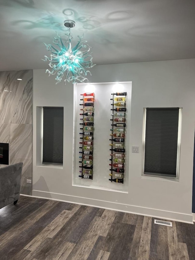 7801 S Seeley Ave, Chicago, IL 60620 - wine cellar with wood finished floors, a chandelier, and baseboards