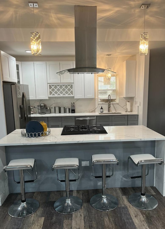 7801 S Seeley Ave, Chicago, IL 60620 - kitchen featuring a sink, island range hood, dark wood-style flooring, and a kitchen breakfast bar