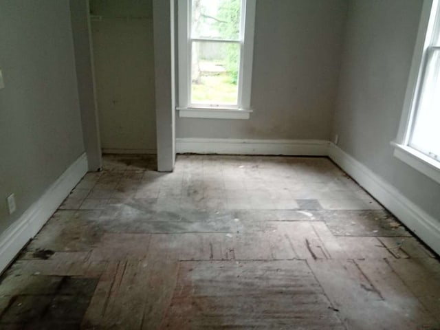 2324 W Wiswall St, Peoria, IL 61605 - unfurnished bedroom with a baseboard heating unit and baseboards