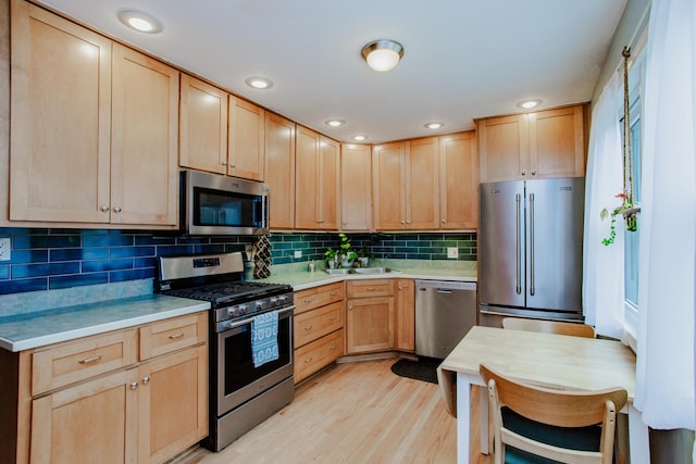 612 S Blvd Unit C, Evanston, IL 60202 - kitchen with stainless steel appliances, light brown cabinetry, light countertops, light wood finished floors, and recessed lighting