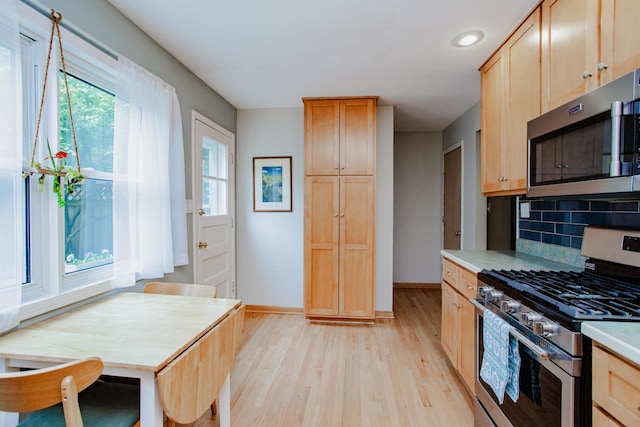 612 S Blvd Unit C, Evanston, IL 60202 - kitchen with stainless steel appliances, light wood-style flooring, healthy amount of natural light, backsplash, and recessed lighting