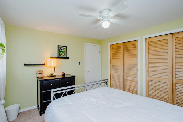612 S Blvd Unit C, Evanston, IL 60202 - bedroom with two closets, light carpet, and a ceiling fan
