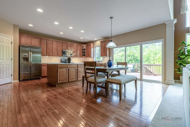 1430 Mcclellan Ct, Lindenhurst, IL 60046 - kitchen featuring stainless steel appliances, light countertops, hardwood / wood-style flooring, recessed lighting, and brown cabinetry