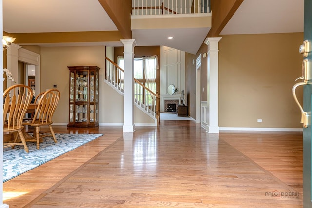 1430 Mcclellan Ct, Lindenhurst, IL 60046 - entryway with decorative columns, baseboards, light wood-type flooring, and stairs