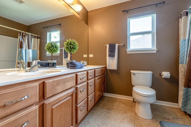 1430 Mcclellan Ct, Lindenhurst, IL 60046 - bathroom featuring double vanity, baseboards, toilet, and tile patterned flooring