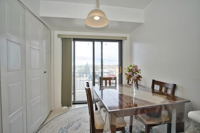4901 Golf Rd Unit 310, Skokie, IL 60077 - dining area with light tile patterned floors