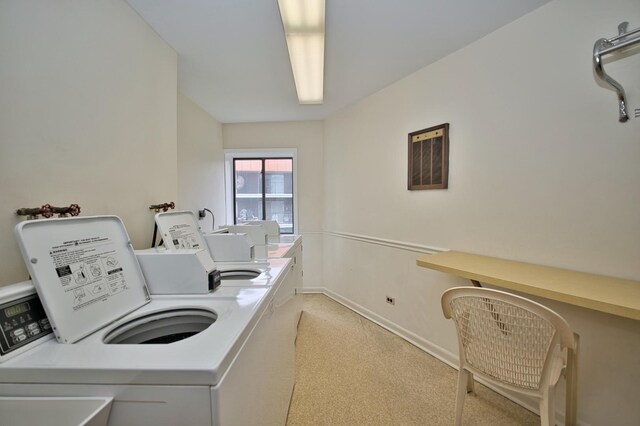 4901 Golf Rd Unit 310, Skokie, IL 60077 - communal laundry room with washer and clothes dryer, light colored carpet, and baseboards