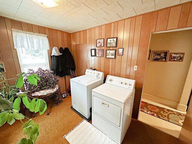117 W 9th St, Streator, IL 61364 - laundry room featuring washing machine and dryer and wood walls
