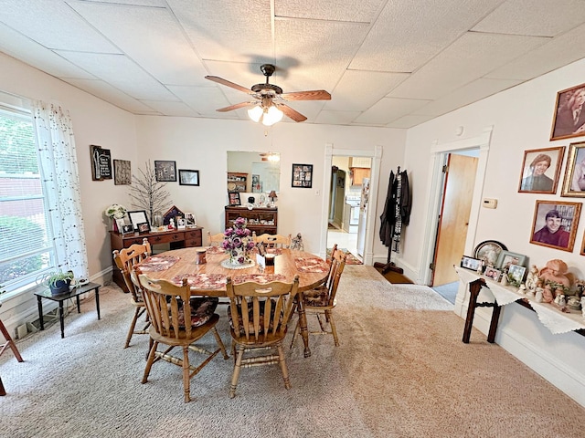 117 W 9th St, Streator, IL 61364 - carpeted dining space featuring ceiling fan and baseboards