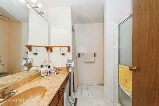 412 Bluebird Ln Unit 412, Deerfield, IL 60015 - bathroom with vanity, a shower with shower door, and tile patterned flooring
