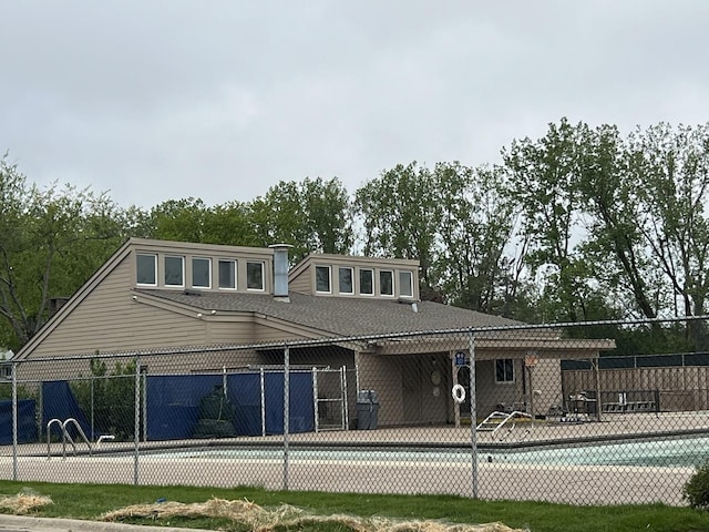412 Bluebird Ln Unit 412, Deerfield, IL 60015 - back of house with a community pool and roof with shingles