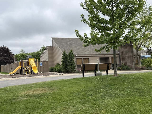 412 Bluebird Ln Unit 412, Deerfield, IL 60015 - view of front facade featuring a front lawn and roof with shingles