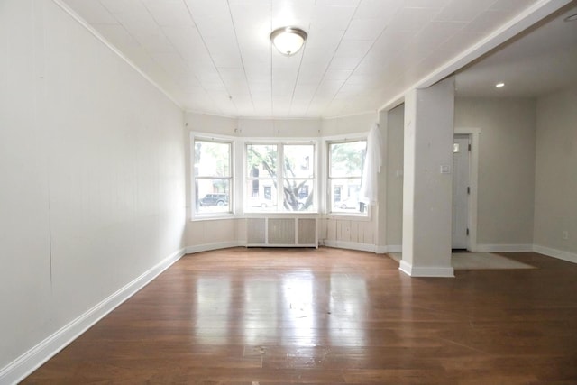 2244 W Irving Park Rd, Chicago, IL 60618 - spare room featuring radiator heating unit, wood-type flooring, and baseboards