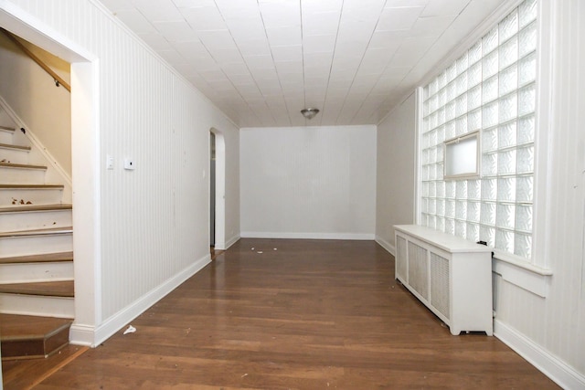 2244 W Irving Park Rd, Chicago, IL 60618 - hallway with wood finished floors, arched walkways, built in shelves, stairs, and baseboards