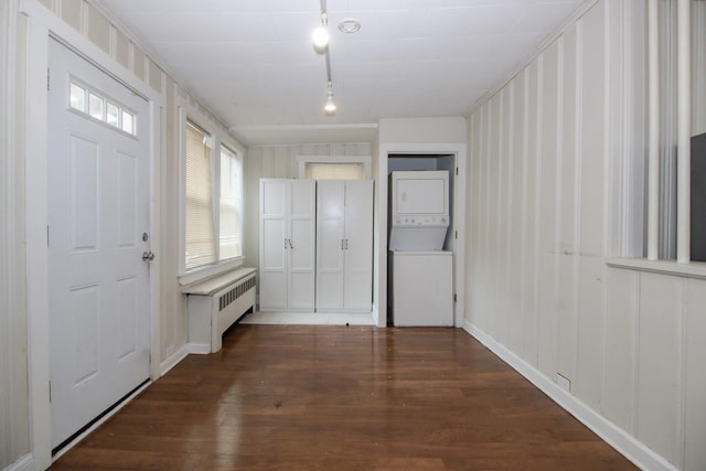 2244 W Irving Park Rd, Chicago, IL 60618 - entrance foyer featuring estacked washer and dryer, radiator, wood finished floors, and track lighting
