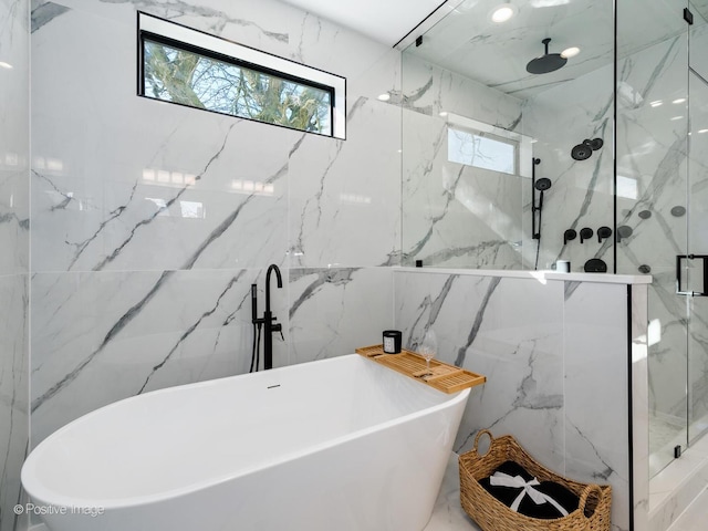 2902 N Seeley Ave, Chicago, IL 60618 - full bathroom with healthy amount of natural light, a marble finish shower, a soaking tub, and tile walls
