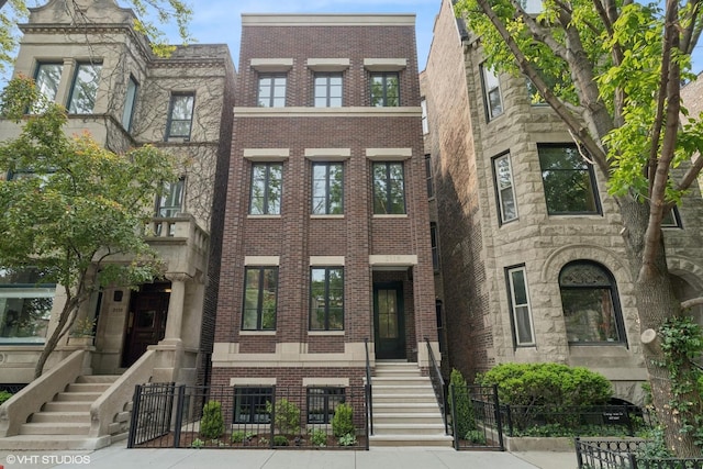 2118 N Sheffield Ave Unit 1, Chicago, IL 60614 - view of property with brick siding and a fenced front yard