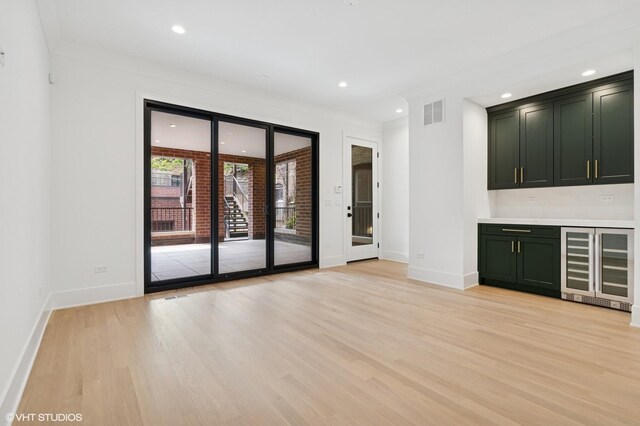2118 N Sheffield Ave Unit 1, Chicago, IL 60614 - bar featuring wine cooler, light wood-style floors, recessed lighting, and ornamental molding