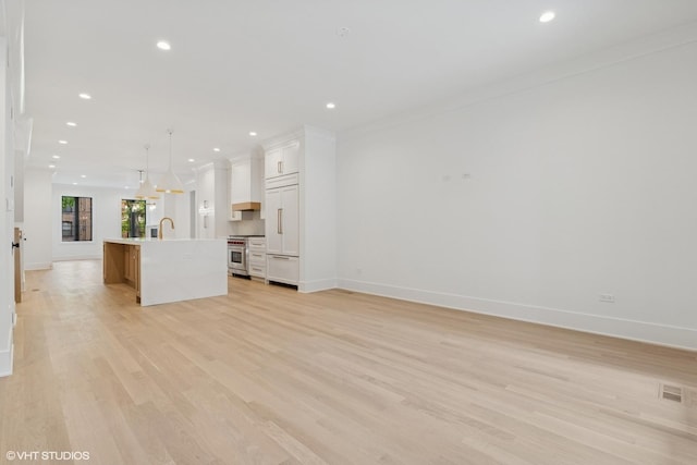 2118 N Sheffield Ave Unit 1, Chicago, IL 60614 - unfurnished living room with recessed lighting, light wood-style flooring, and ornamental molding