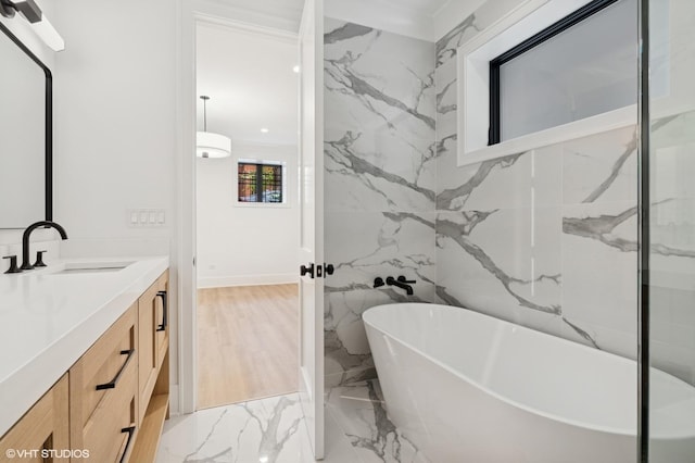 2118 N Sheffield Ave Unit 1, Chicago, IL 60614 - bathroom with vanity, a freestanding bath, and marble tiled floors