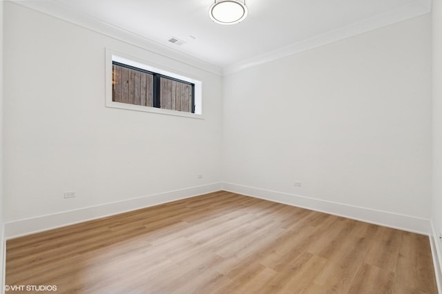 2118 N Sheffield Ave Unit 1, Chicago, IL 60614 - spare room featuring light wood-style floors and crown molding