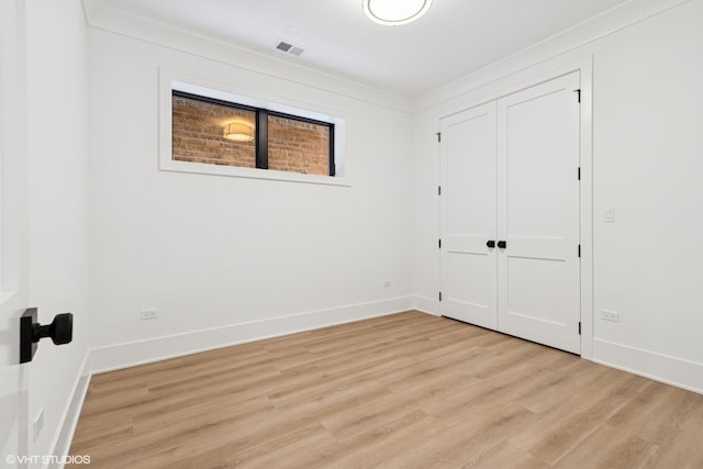 2118 N Sheffield Ave Unit 1, Chicago, IL 60614 - unfurnished bedroom with light wood finished floors and a closet