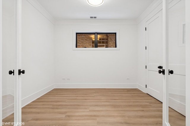 2118 N Sheffield Ave Unit 1, Chicago, IL 60614 - unfurnished bedroom with light wood-style flooring, a closet, and ornamental molding