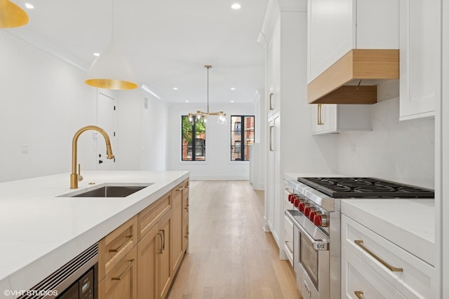 2118 N Sheffield Ave Unit 1, Chicago, IL 60614 - kitchen featuring range with two ovens, light wood-type flooring, light countertops, recessed lighting, and pendant lighting