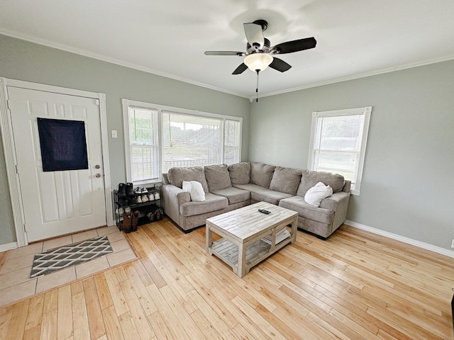 1003 Bazore St, Streator, IL 61364 - living area with wood-type flooring, ornamental molding, ceiling fan, and baseboards