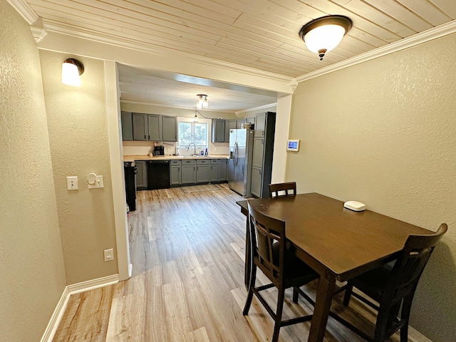 1003 Bazore St, Streator, IL 61364 - dining space with crown molding, wood ceiling, a textured wall, light wood-style floors, and baseboards