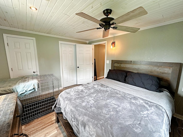 1003 Bazore St, Streator, IL 61364 - bedroom featuring crown molding, light wood-type flooring, a closet, wood ceiling, and ceiling fan
