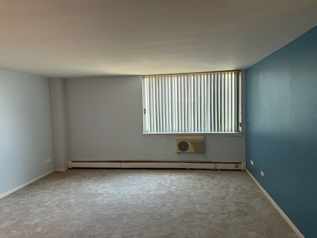 20 N Tower Rd Unit 6J, Oak Brook, IL 60523 - carpeted empty room with baseboard heating, a wall unit AC, and baseboards
