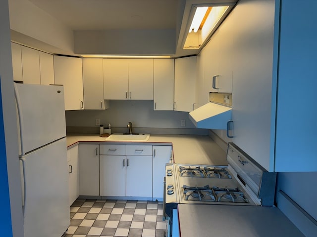 20 N Tower Rd Unit 6J, Oak Brook, IL 60523 - kitchen featuring white appliances, a sink, ventilation hood, light countertops, and white cabinets