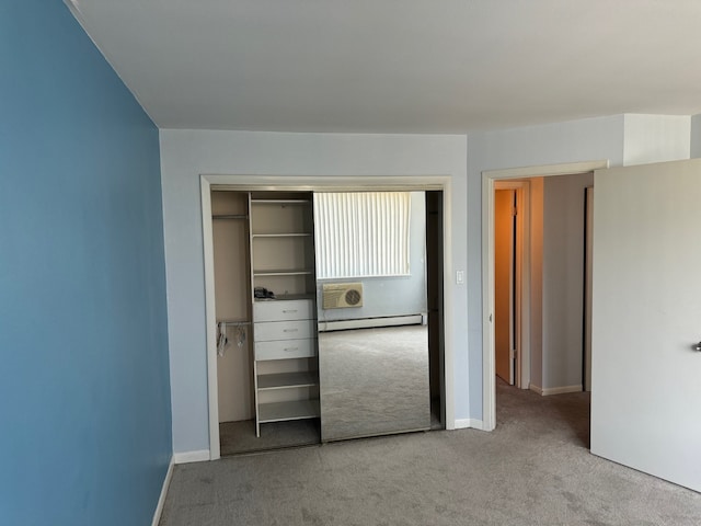 20 N Tower Rd Unit 6J, Oak Brook, IL 60523 - unfurnished bedroom with a baseboard heating unit, carpet flooring, a closet, and baseboards
