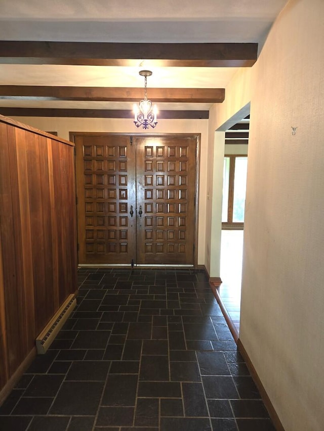 1720 Stratford Ln, Rockford, IL 61107 - foyer entrance featuring beamed ceiling, baseboards, and a chandelier